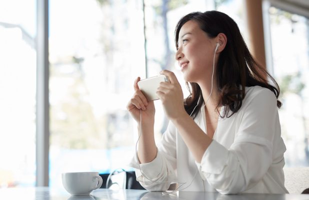 People listening to Audible on their smartphones